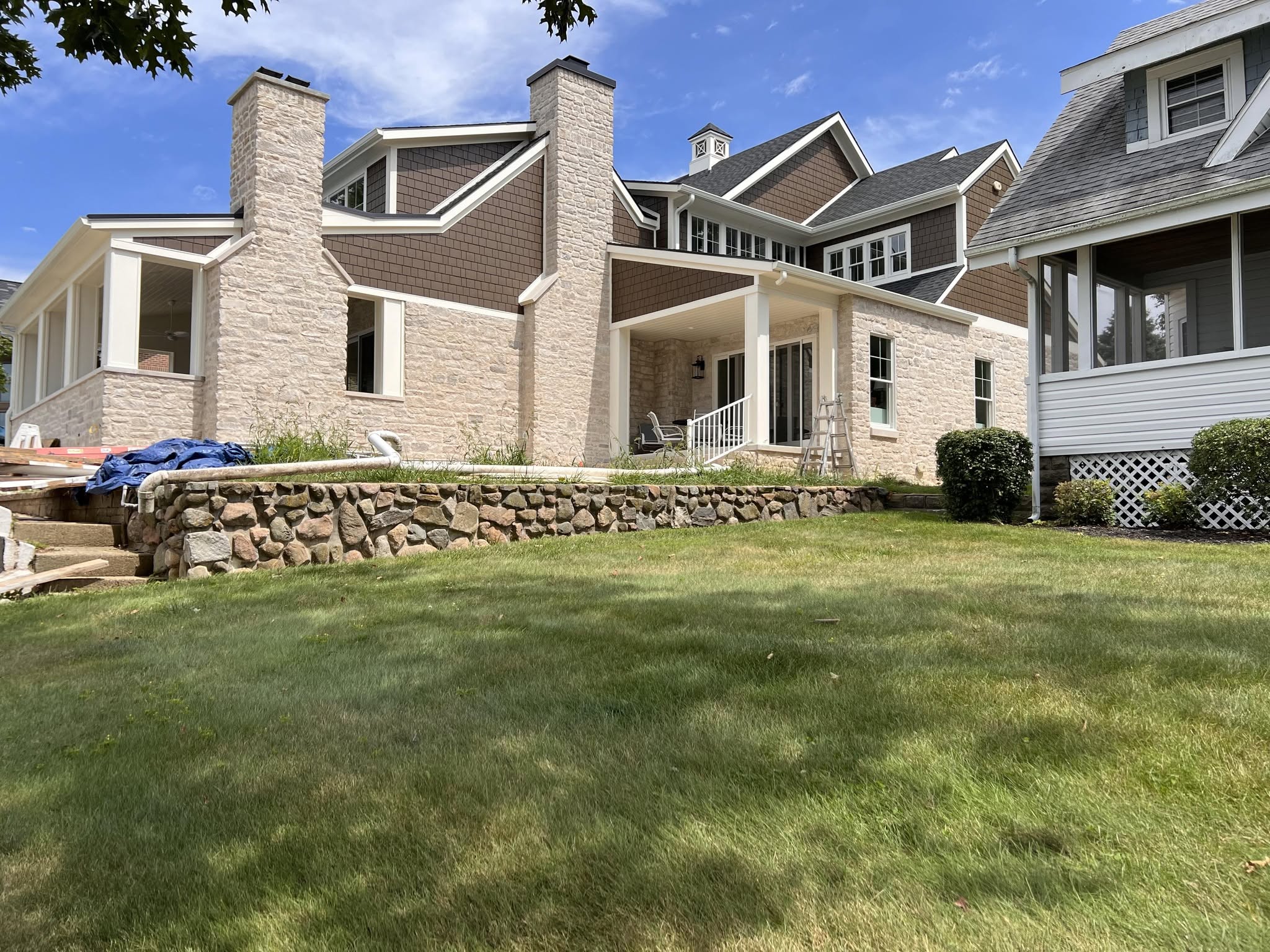 Custom home with stone veneer and cedar shake siding