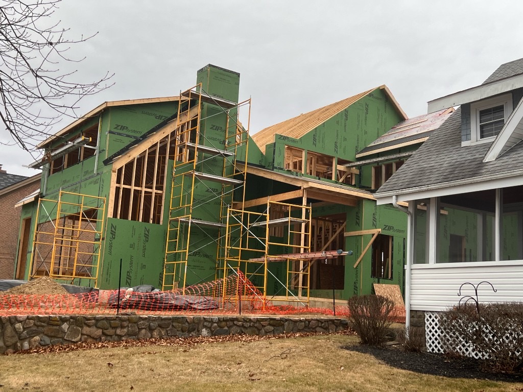 Custom home framed with ZIP System sheathing and scaffolding during exterior construction